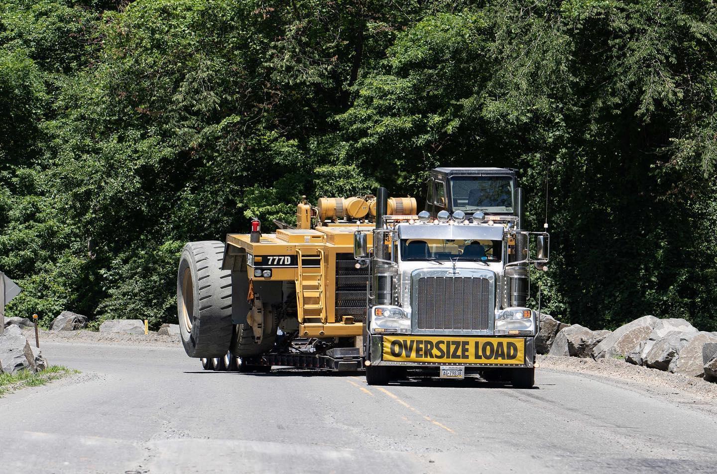 B. Blair heavy haul truck with oversize load on mountain road